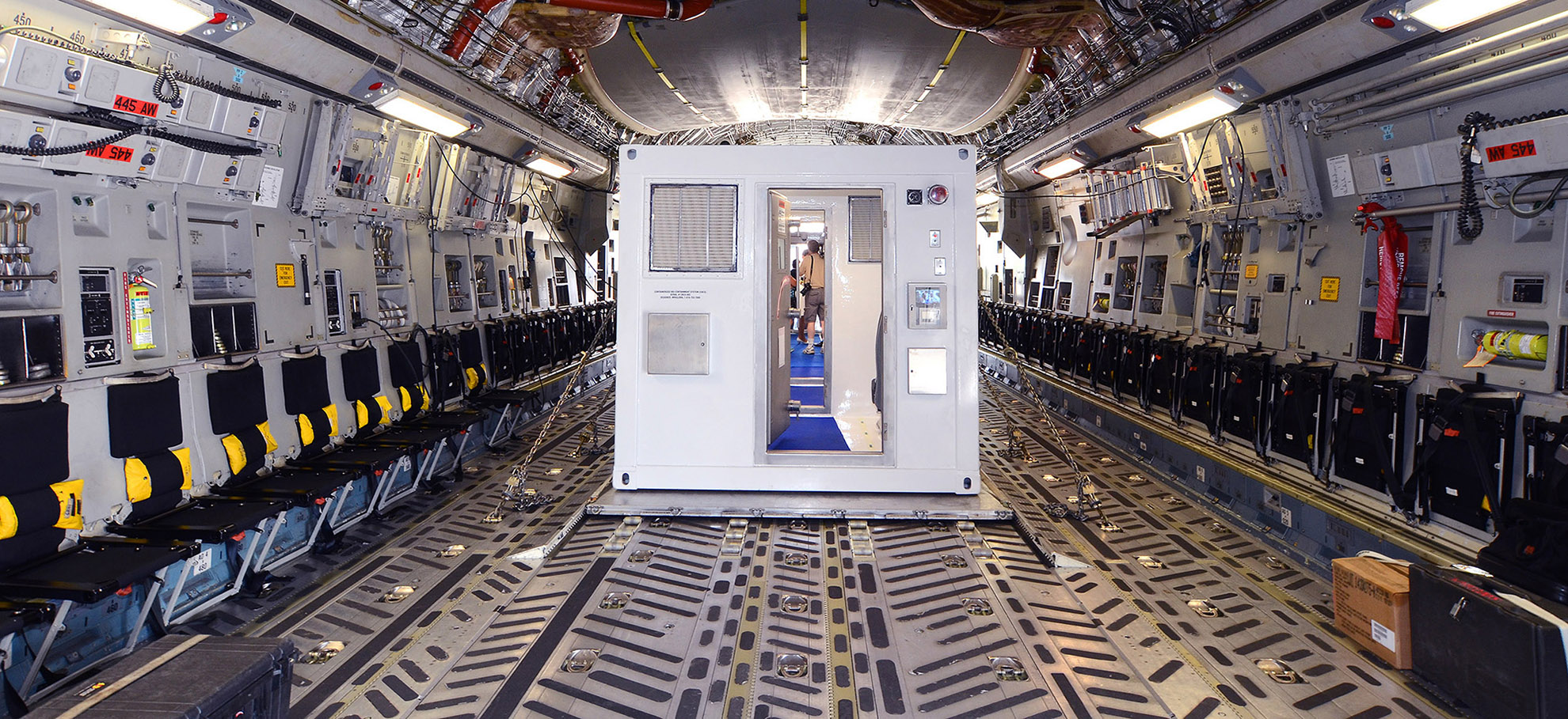 Containerized Bio Containment System being loaded on a Cargo Plane