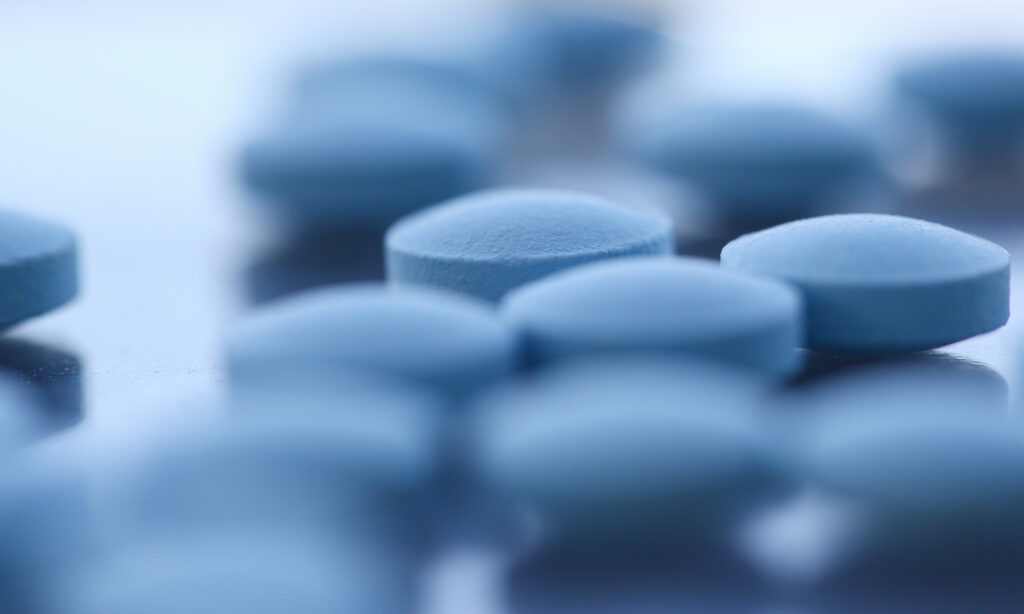Close up of light blue pills